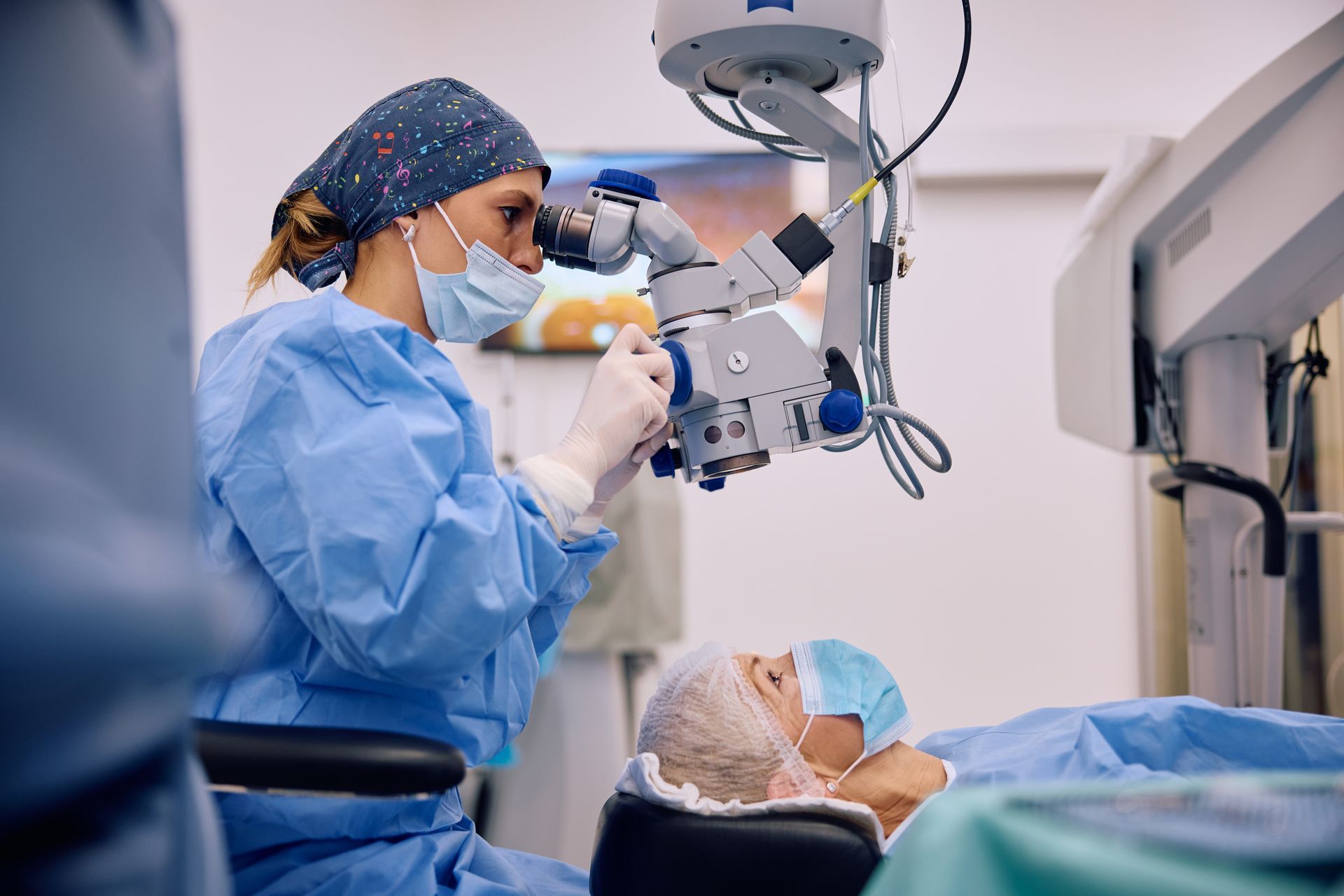 Mature woman undergoing an eye surgery at ophthalmology clinic. Mature woman undergoing an eye surgery at ophthalmology clinic.