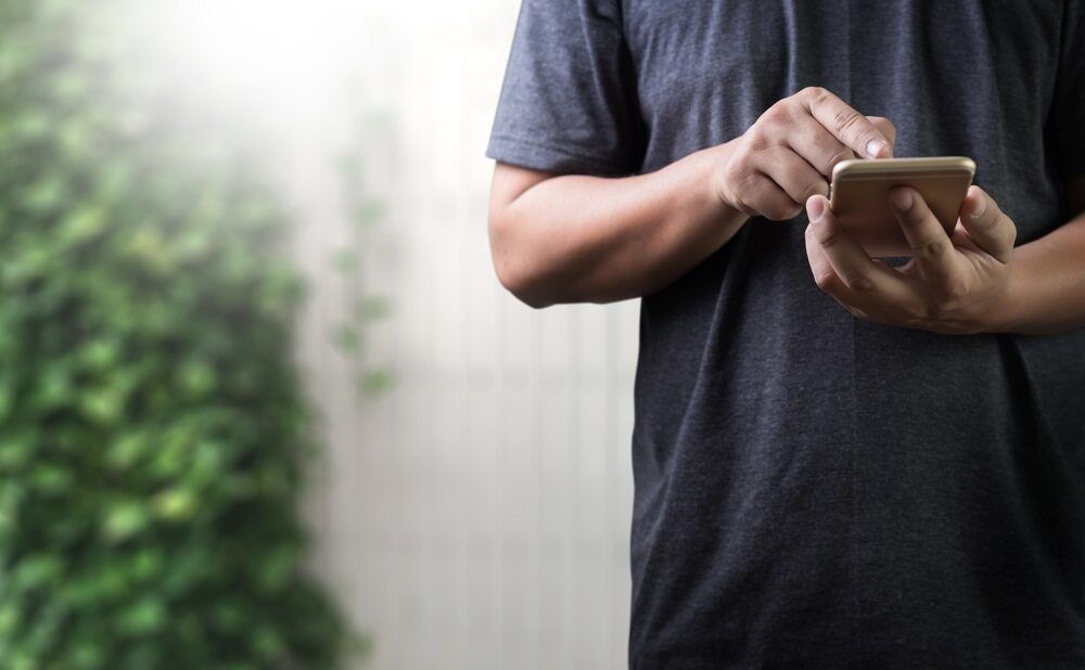 Man On Mobile Phone — Michael Andrews Taxation & Accounting Services In Pacific Paradise, QLD