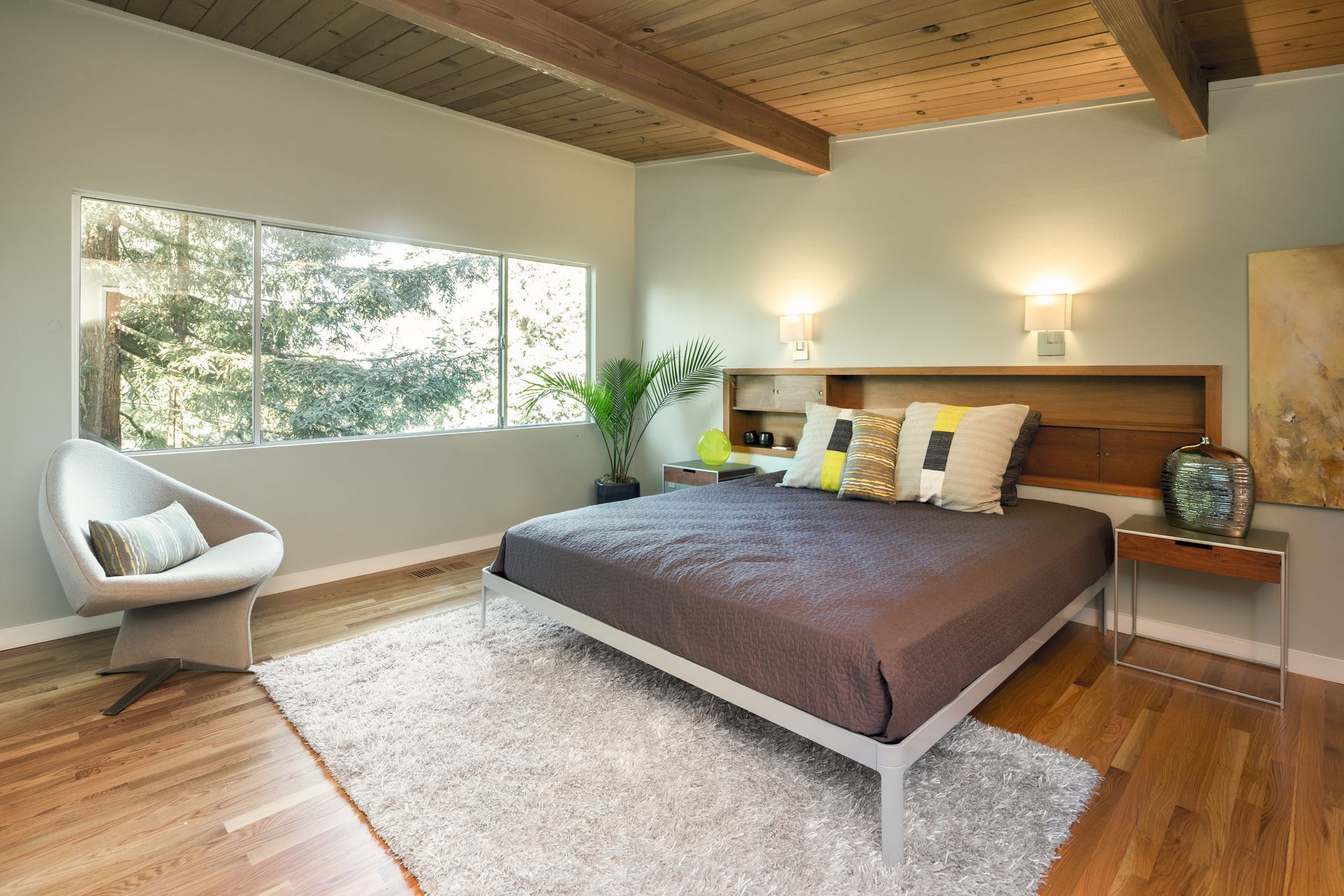 A neatly made bed featuring sheets and pillows, creating a clean and inviting sleeping space.