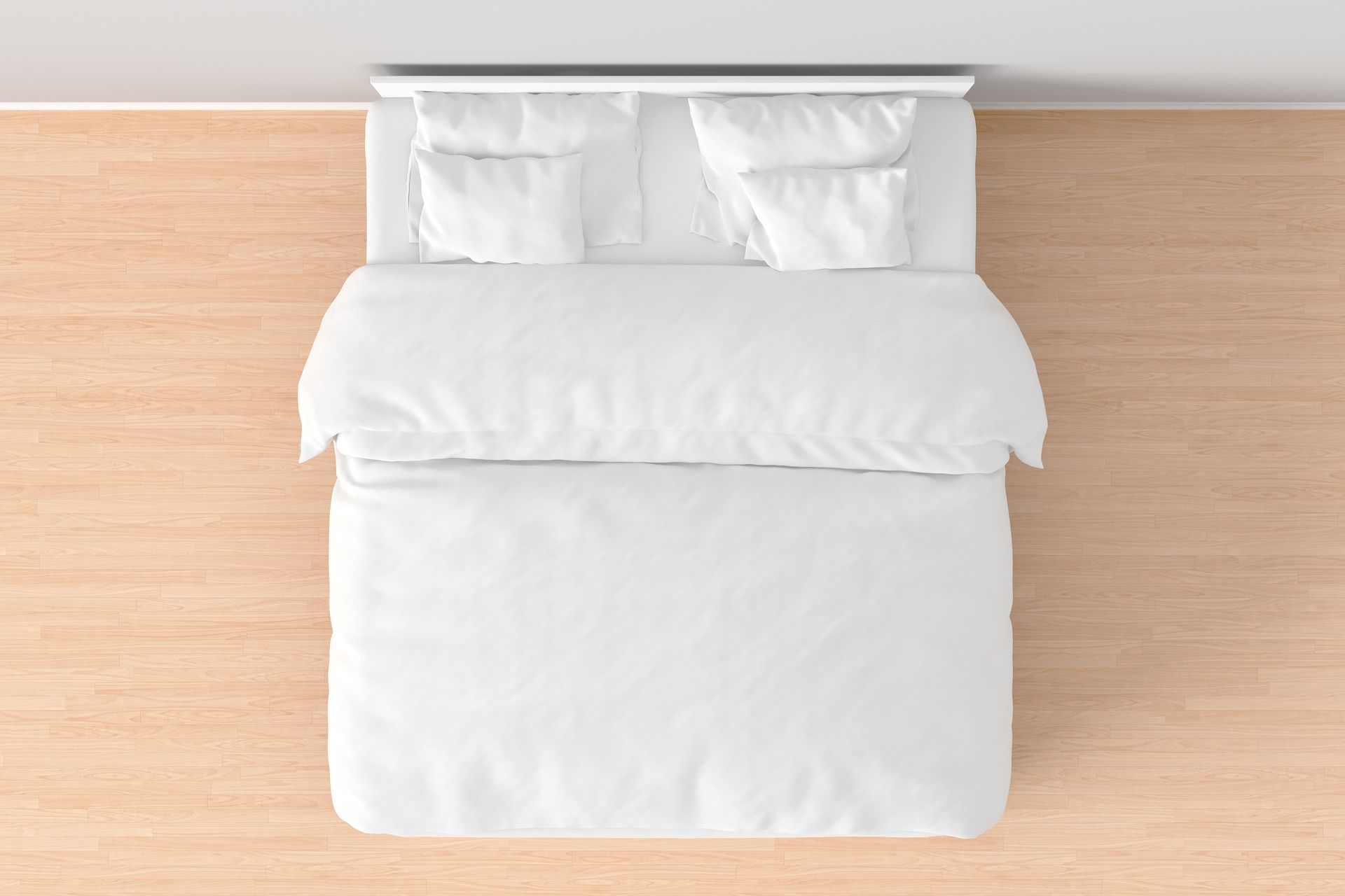 A queen-size double bed with white linens.