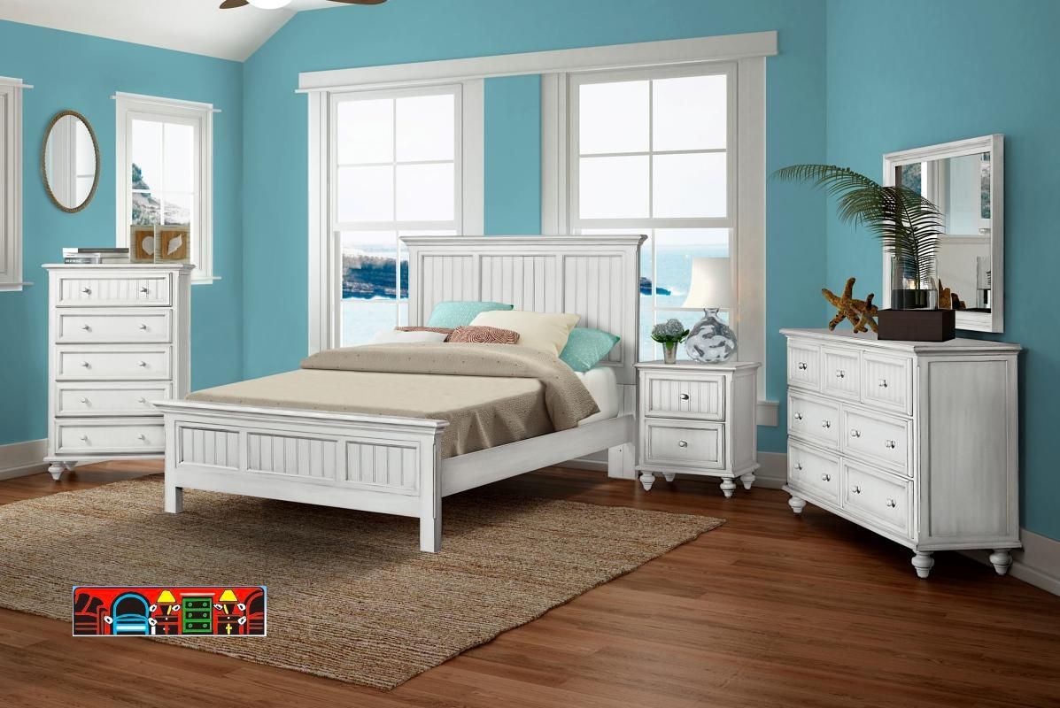 The Monaco Bedroom Set, available at Bratz-CFW in Fort Myers, FL, showcases a casual design with solid wood construction, a distressed white finish, elegant turned feet, and beadboard detailing.