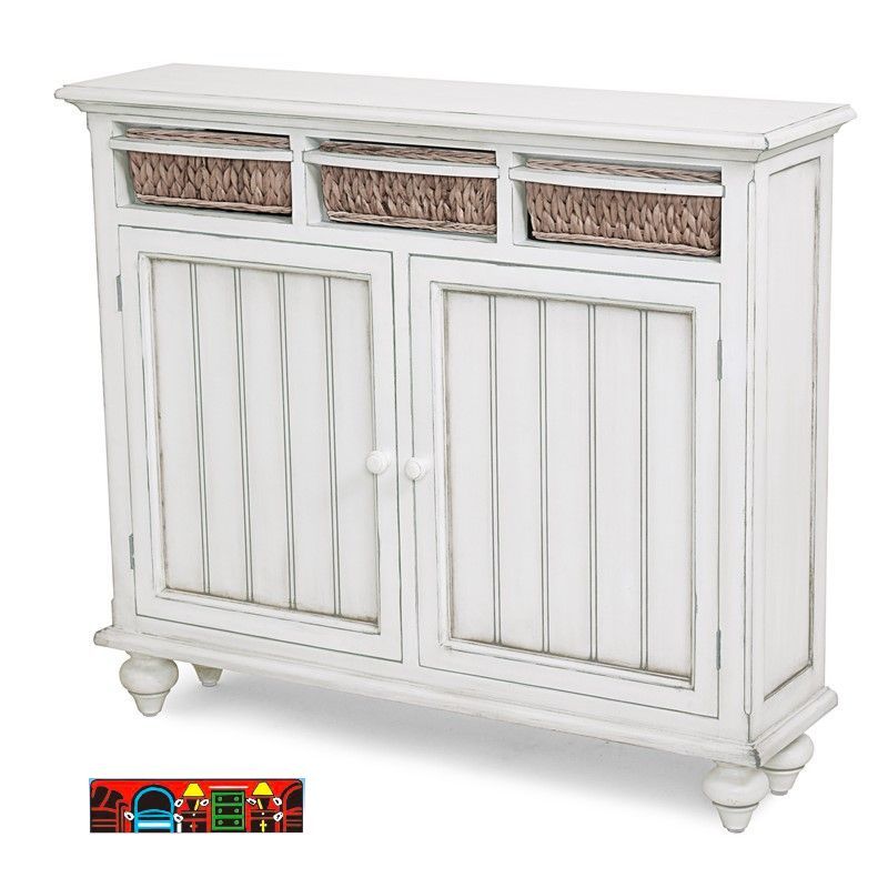 'A slender white entry cabinet featuring two distressed doors, complemented by three hard baskets in a natural hue positioned above the doors.'