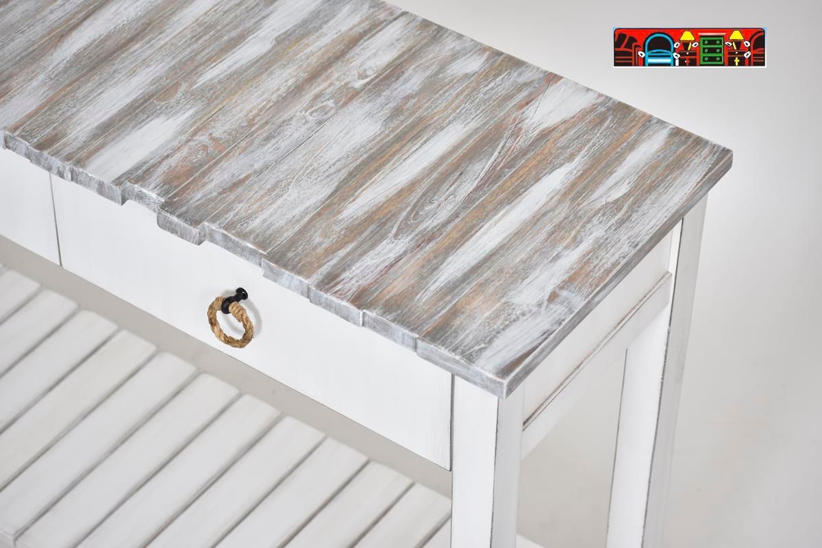 The Picket Fence Entertainment Center offers a coastal charm with its solid wood construction, distressed white finish, weathered grey top, and rope pulls. Available at Bratz-CFW.