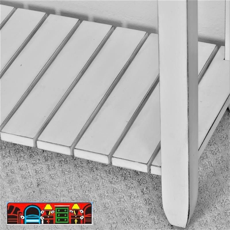 The Picket Fence Occasional Tables offers a coastal charm with its solid wood construction, distressed white finish, weathered grey tops, and rope pulls. Available at Bratz-CFW. Base Close-up.