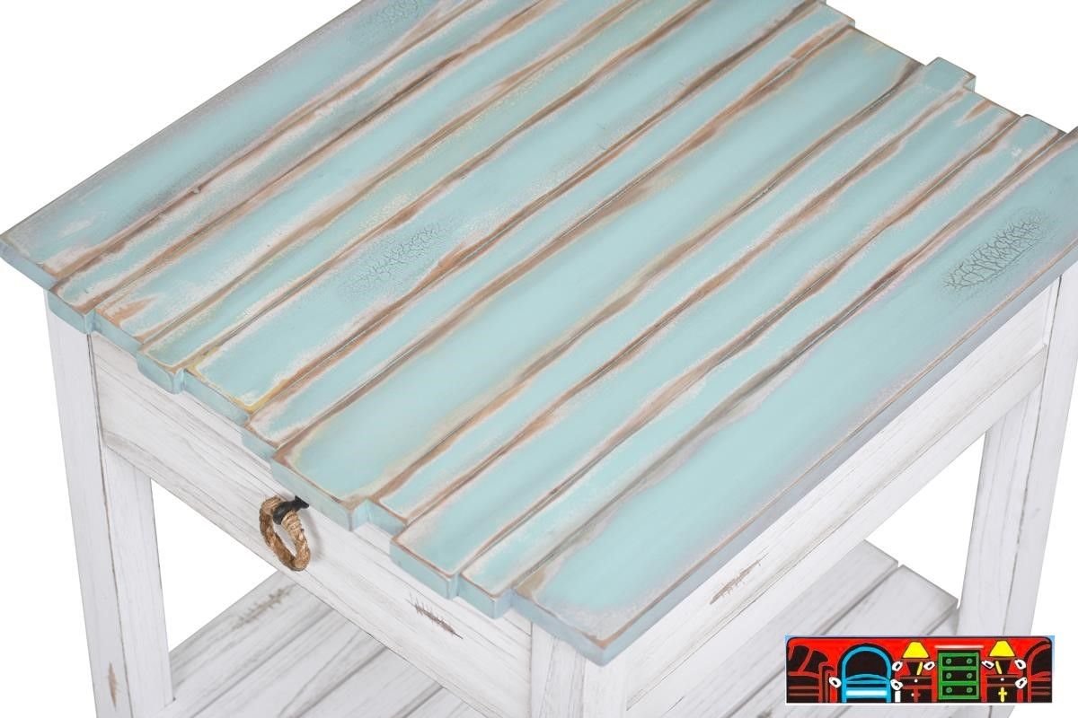 The Picket Fence Occasional Tables offer a coastal charm with its solid wood construction, distressed white finish, weathered blue tops, and rope pulls. Available at Bratz-CFW. Top Close-Up.