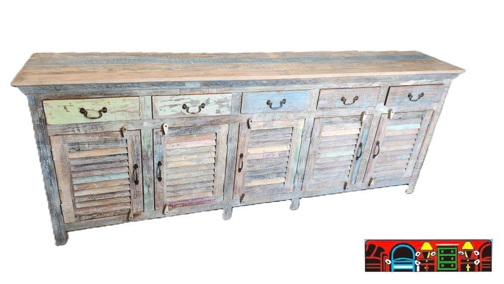 This sideboard is made of solid reclaimed wood in a multicolor finish. It has four drawers on the top and four doors on the bottom, each with an iron handle. There is a shelf behind each door for extra storage space.