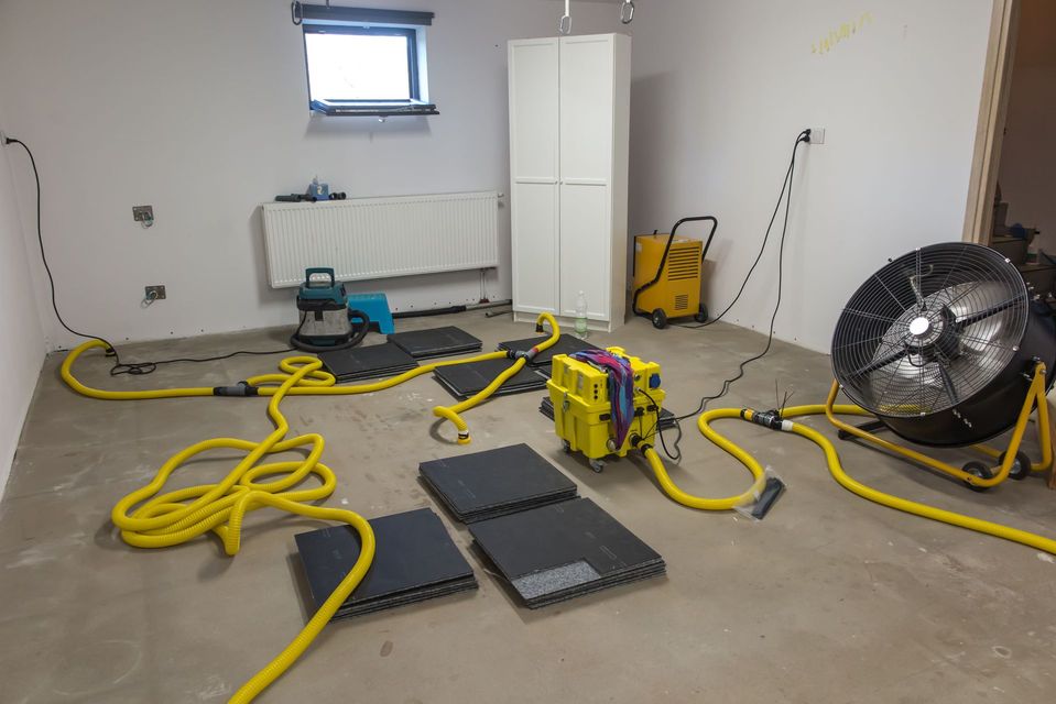A room with a lot of electrical equipment on the floor.