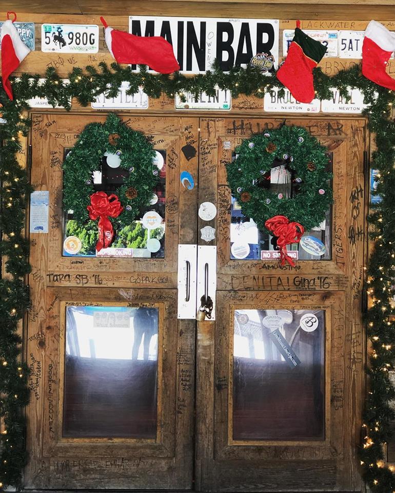 A wooden double door labeled