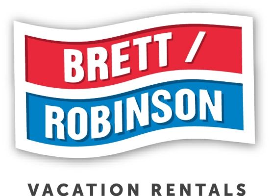 The Brett/Robinson Vacation Rentals logo featuring red and blue wavy banners with white text.
