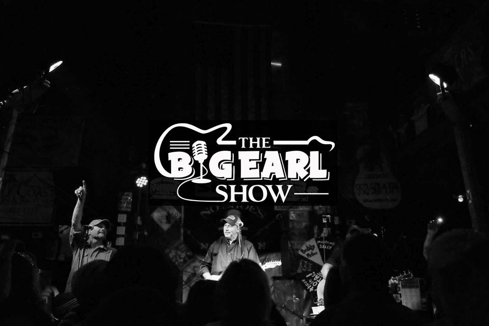 Black and white photo of a live concert stage with a logo reading
