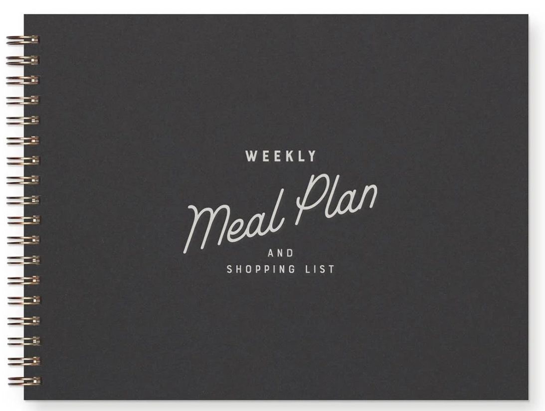 Black spiral-bound meal planner notebook with