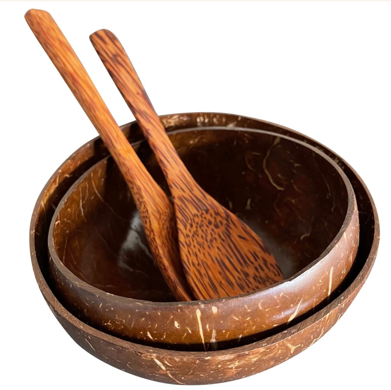 Two coconut bowls with wooden spoons. Brown color.