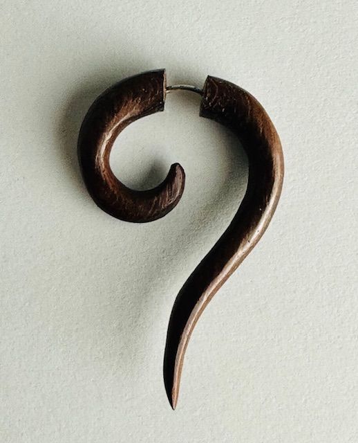 Dark brown wooden spiral earring.