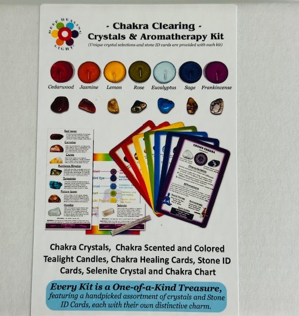 A Chakra Clearing Crystals & Aromatherapy Kit. The package contains colored crystals, candles, cards, and a chart.