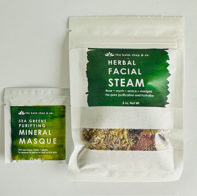 Spa products: herbal facial steam and mineral masque in white packaging with green labels.