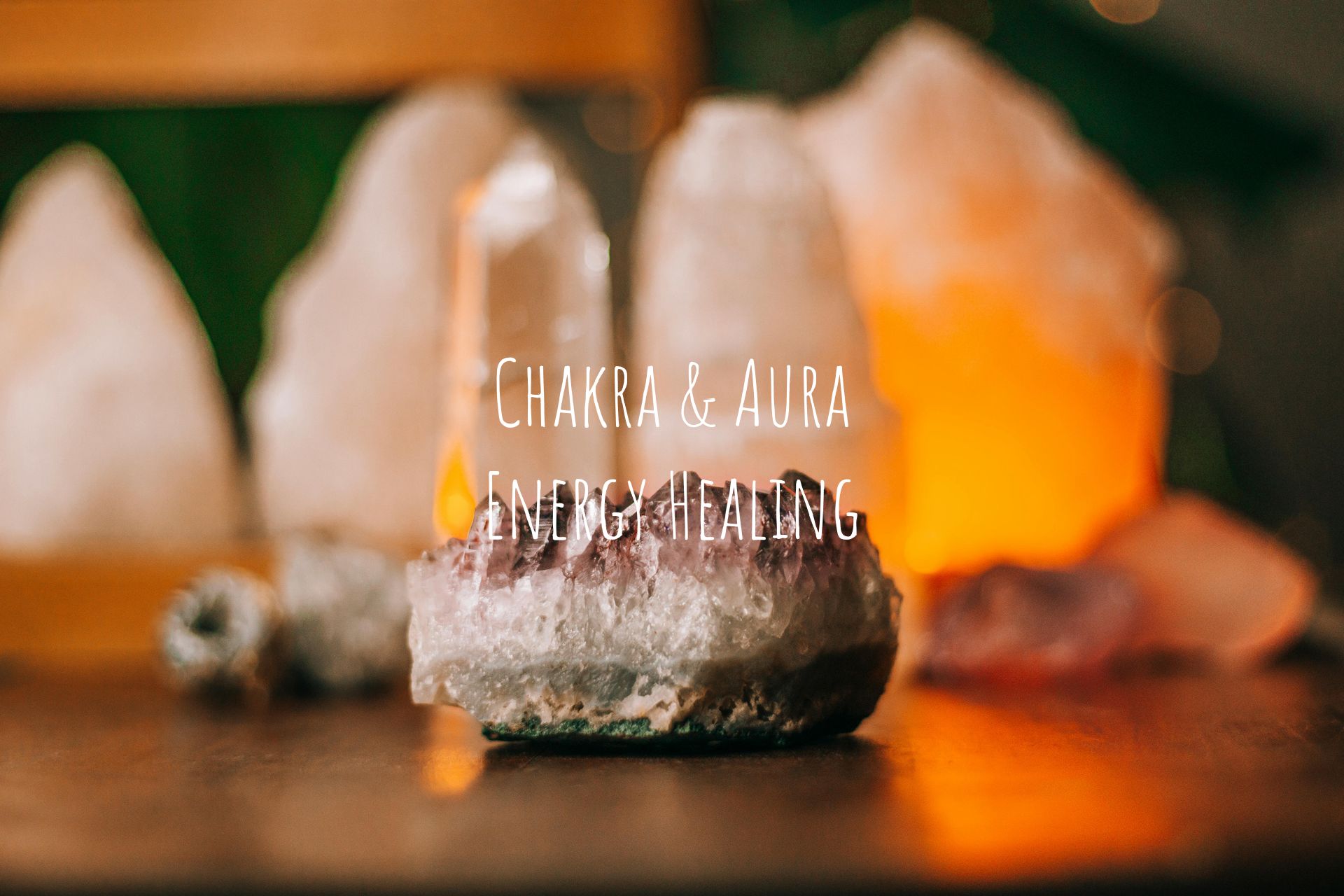 Amethyst crystal with glowing salt lamps, text overlay reading “CHAKRA & AURA ENERGIES”.