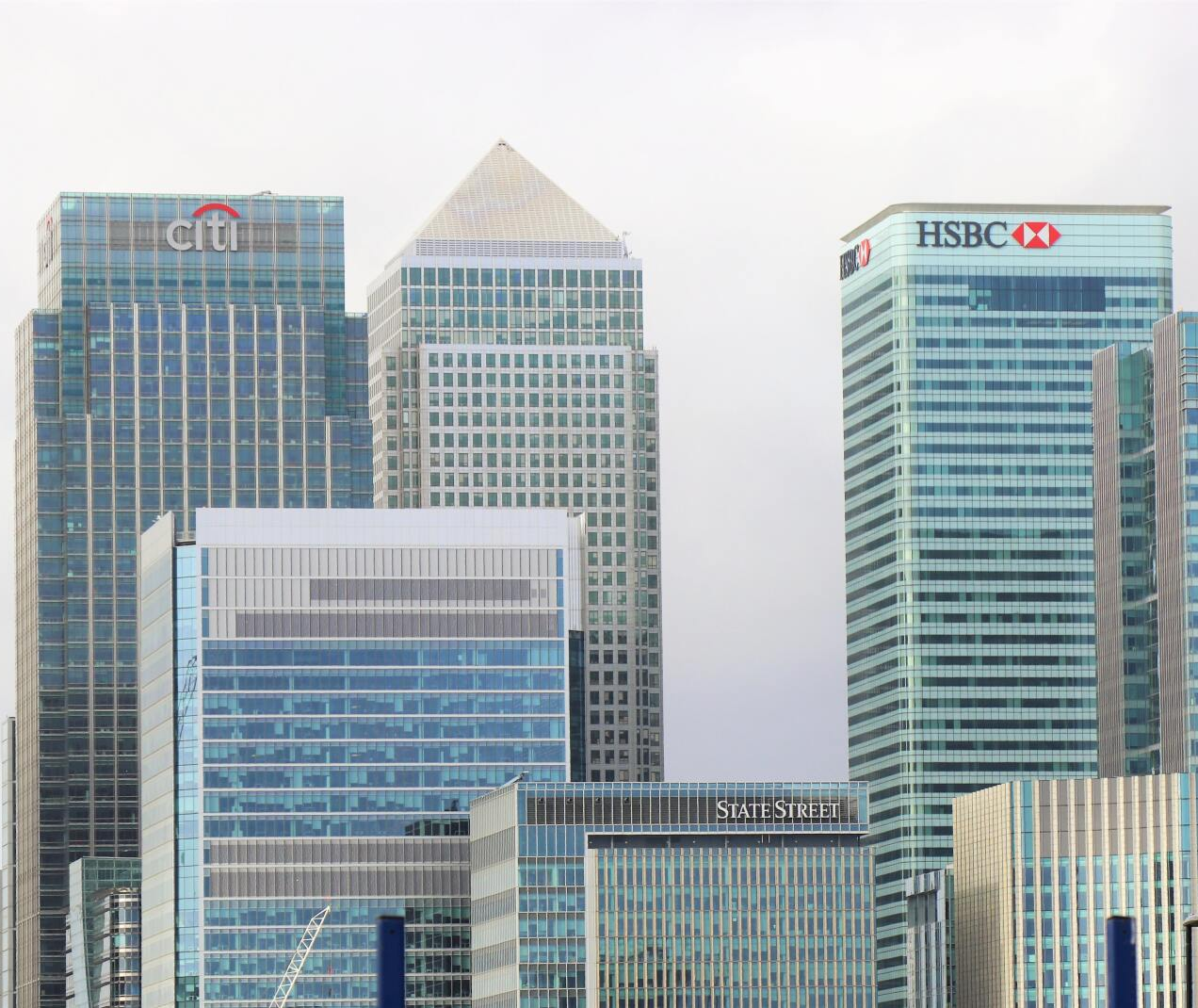 Skyscrapers in Canary Wharf, London, featuring the Citigroup and HSBC towers with reflective glass facades.