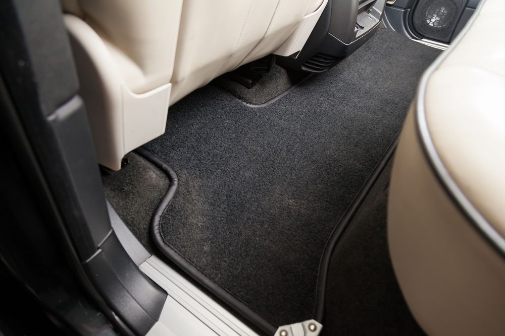 A close up of a floor mat in a truck.