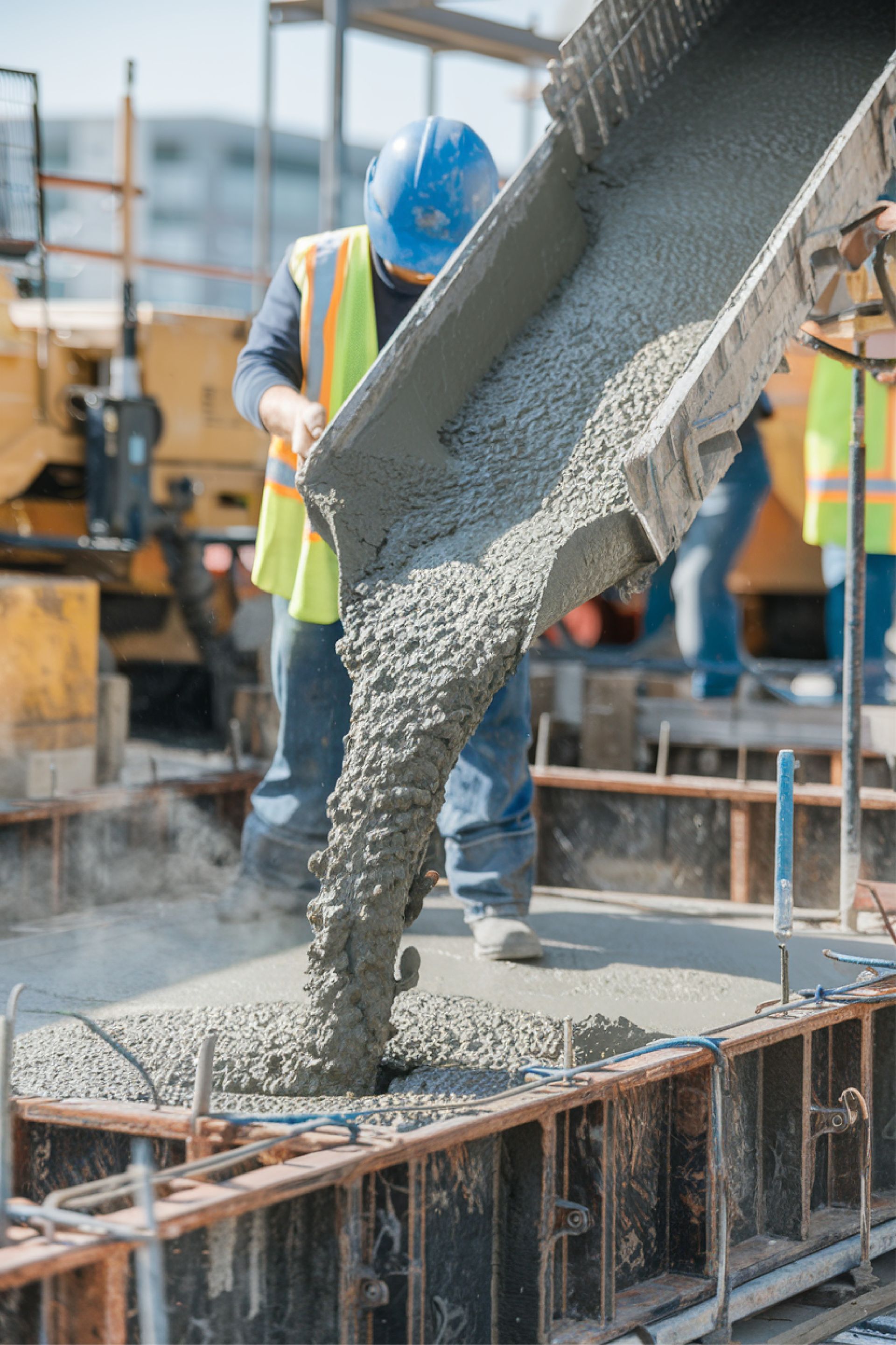 A row of houses with a white picket fence in a residential neighborhood.