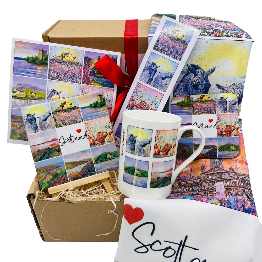 Personalized gift set with photo tiles, mug, shirt, pillow, and ribboned box featuring colorful landscapes