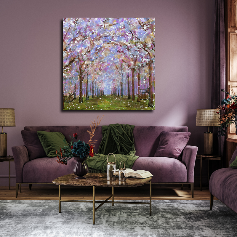 Purple living room with velvet sofa, coffee table, gray rug, and a pastel blossom painting above the couch