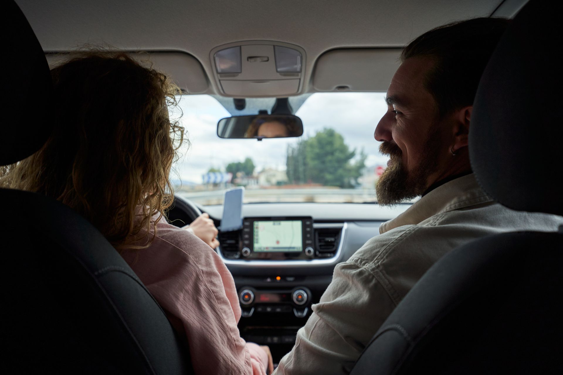 Young Couple Talking Inside car, Concept for Auto Insurance Quotes | Forest City, NC