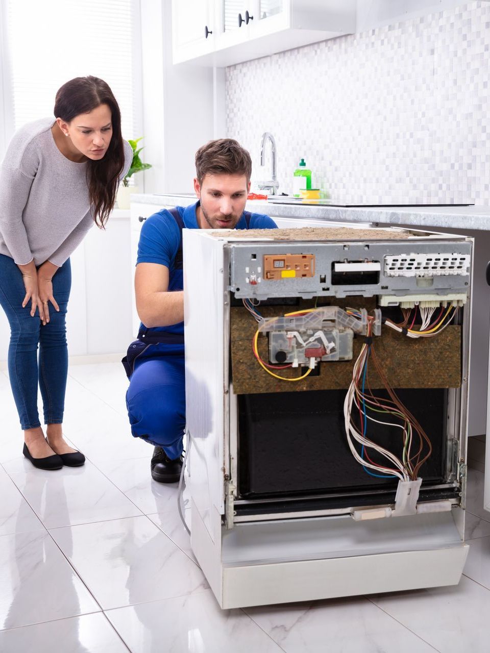 technician performing appliance repair services