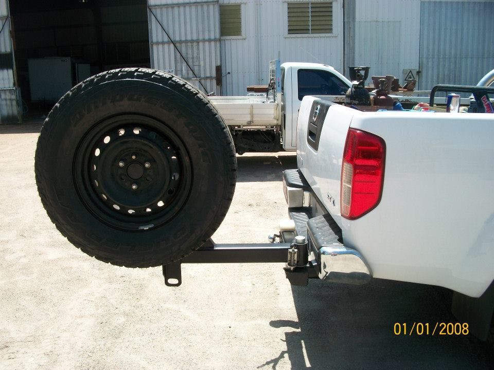 A White Truck With A Spare Tire Attached To It — Kaplan Engineering Pty Ltd In Bowen, QLD