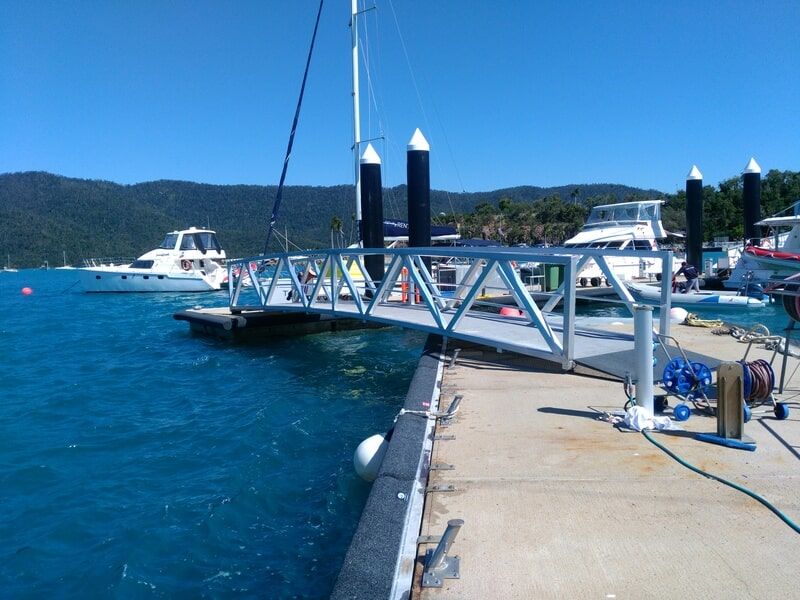 Marina Dock With Boats, Blue Water, And A White Gangwa — Kaplan Engineering Pty Ltd In Bowen, QLD