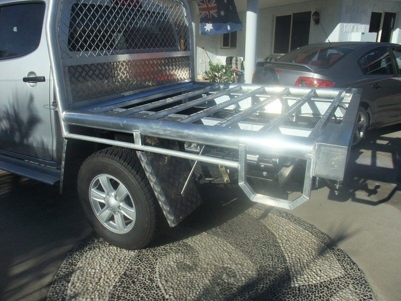 Silver Utility Trailer Attached To A White Pickup Truck, Parked In A Driveway — Kaplan Engineering Pty Ltd In Bowen, QLD