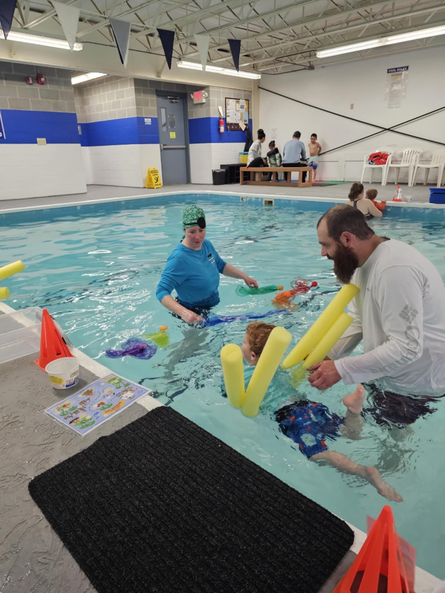 Instructor teaching swim lessons