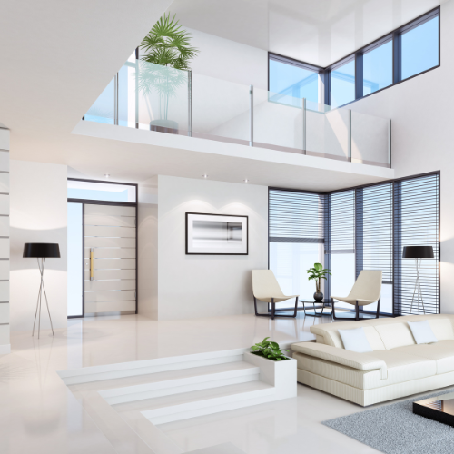 A living room with a couch and chairs and a balcony