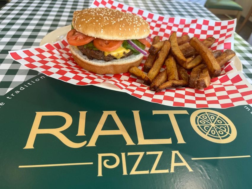 Burger and fries on red checkered paper with Rialto Pizza logo.