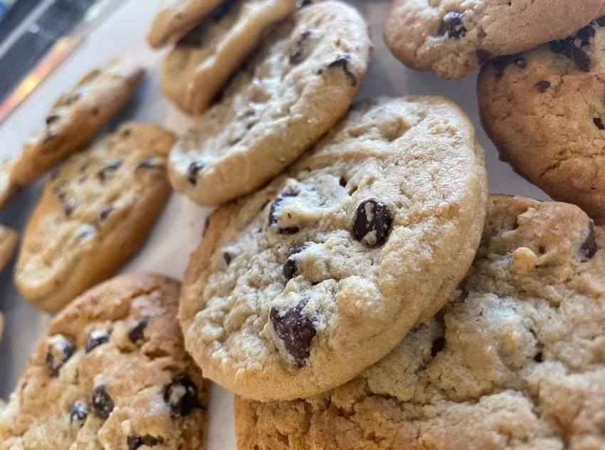 Pile of chocolate chip cookies. Close-up view of golden-brown, baked treats.