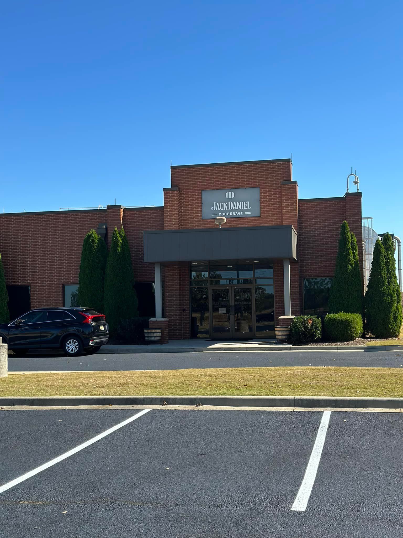 Brick building with a sign that reads 