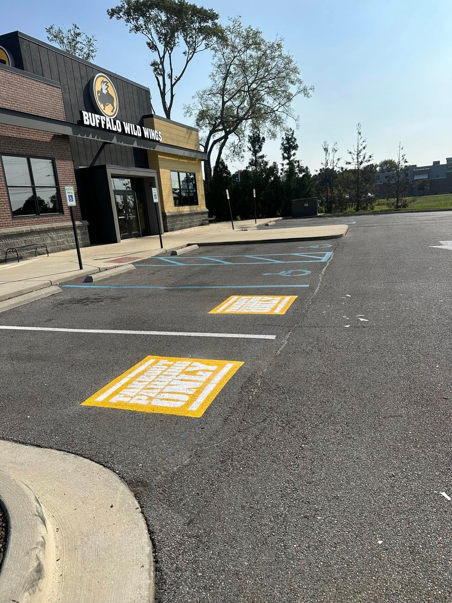 Parking lot with accessible parking spaces in front of a restaurant.