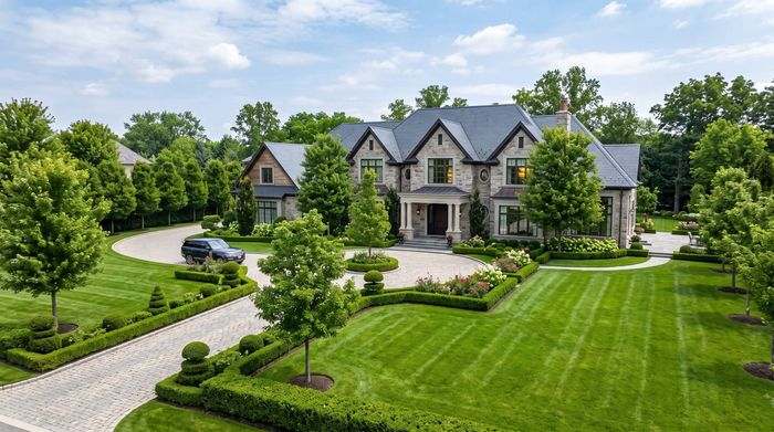 Luxury house with freshly trimmed trees in the front yard