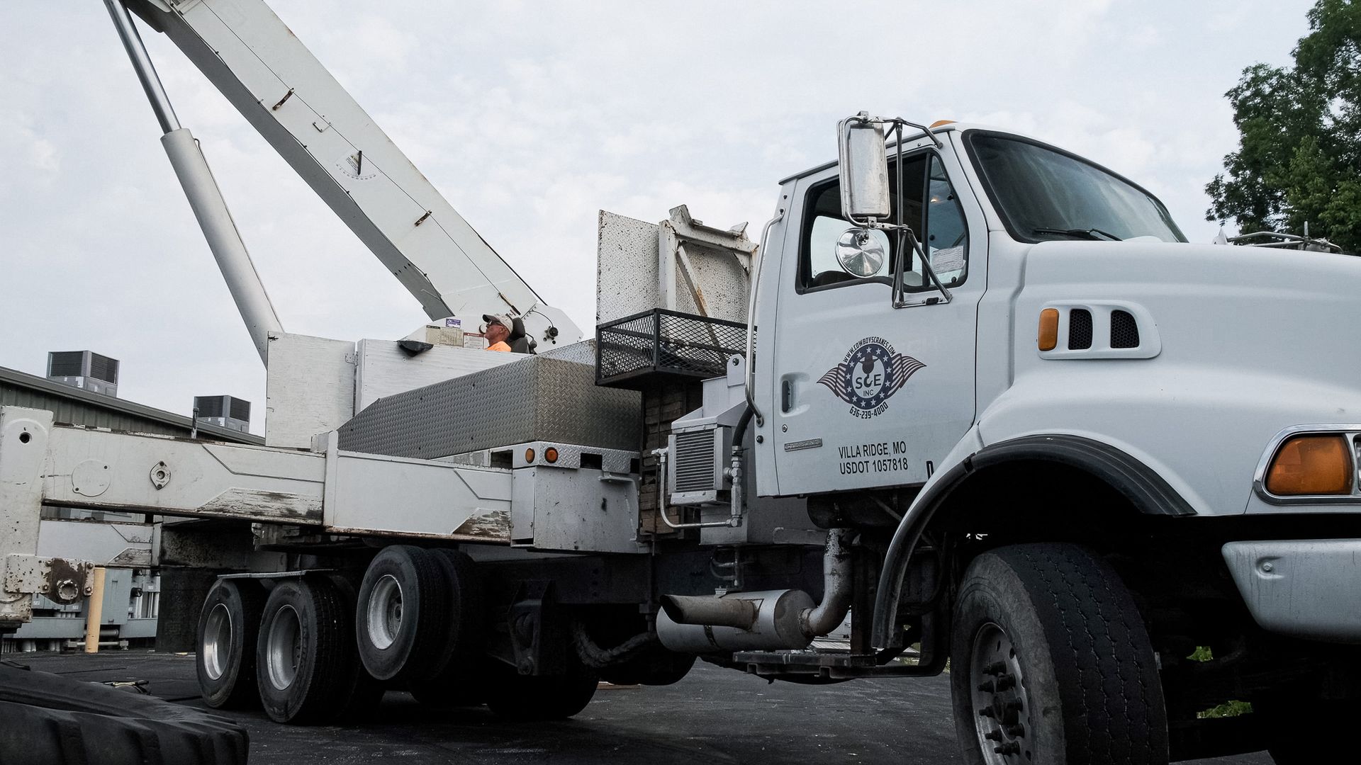 A White Truck with A Crane Attached to It | Union, MO | Menke Heating and Cooling