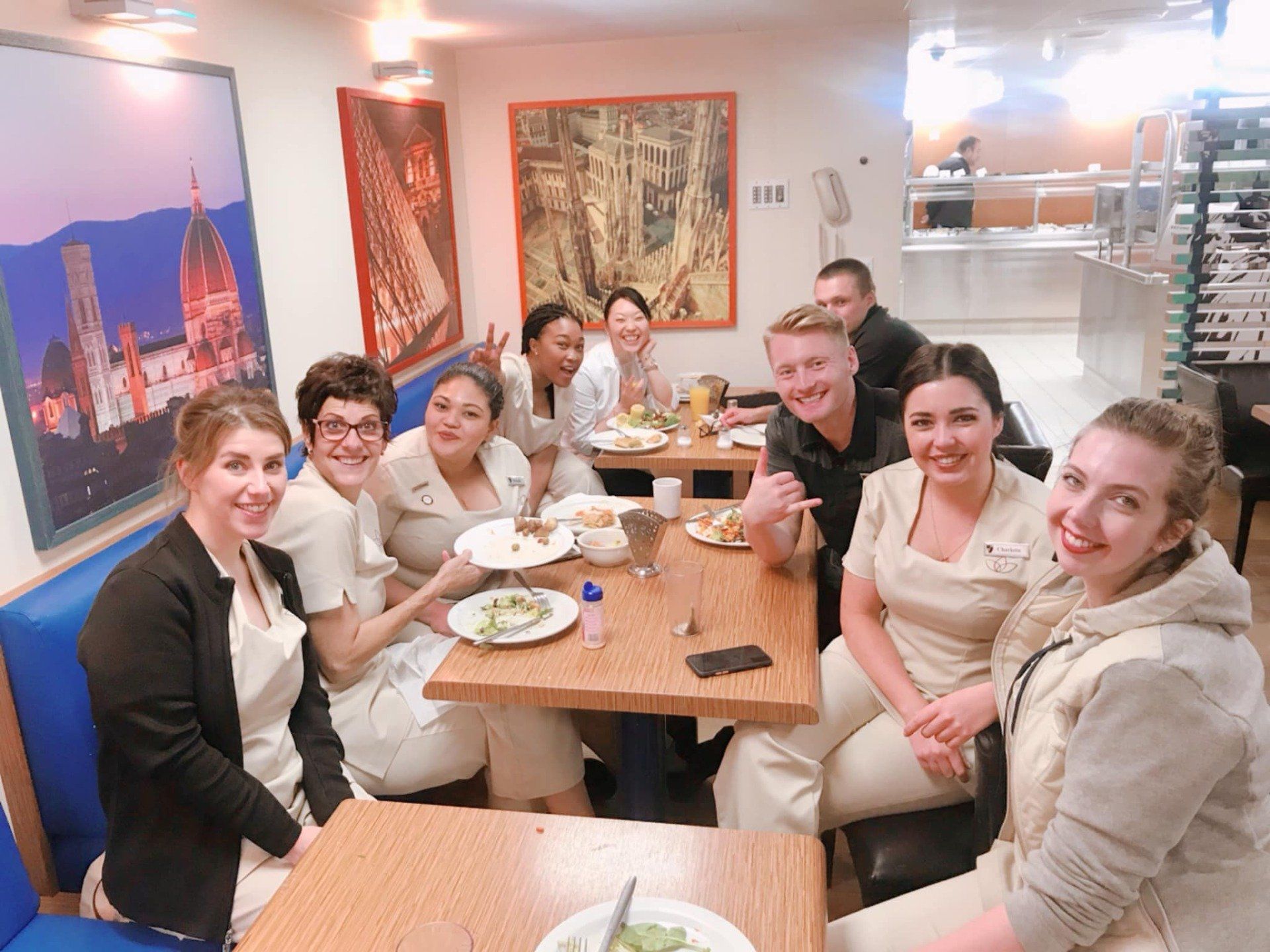 Xander Clemens in the crew mess of the Seabourn Quest with crew members.