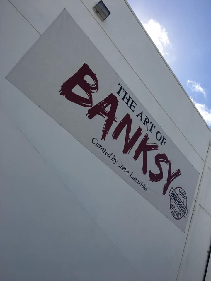 Logo of Banksy art exhibition in Miami, Florida