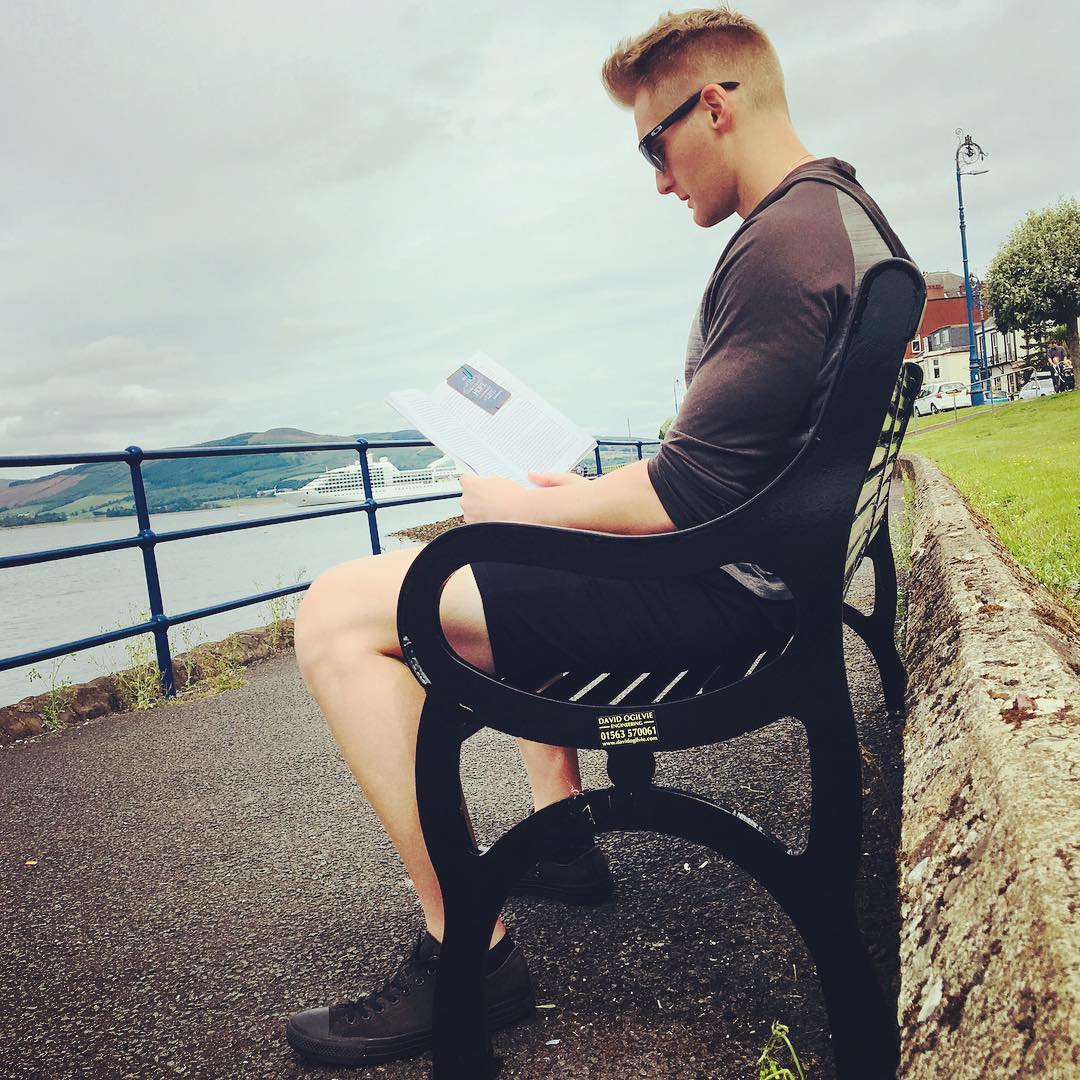 Xander Clemens in the Isle of Bute reading The Untethered Soul The Journey Beyond Yourself by Michael Singer