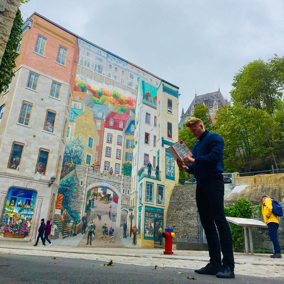 Xander Clemens is in Quebec City, Canada reading the book How to Win Friends and Influence People