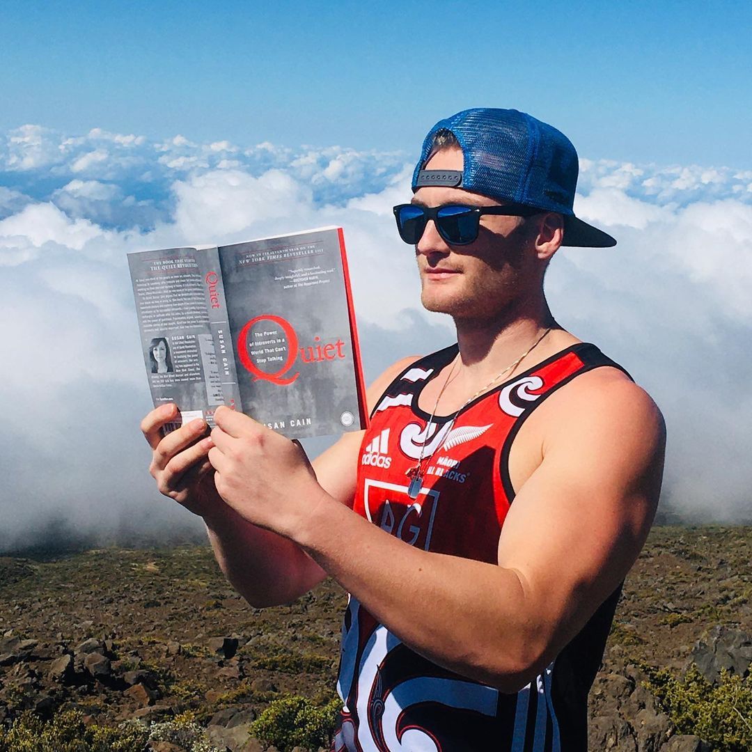 Xander Clemens is reading the book Quiet by Susan Cain in HaleakalaΜ National Park