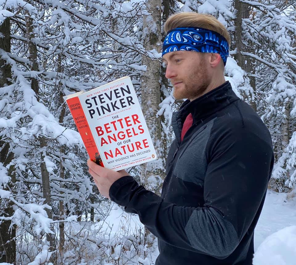 Xander Clemens in Anchorage, Alaska reading The Better Angeles of our Nature by Steven Pinker