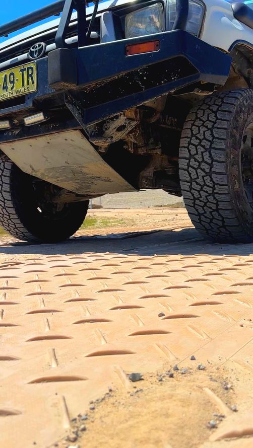 image of sand coloured track mats, with MKP molded down one side
