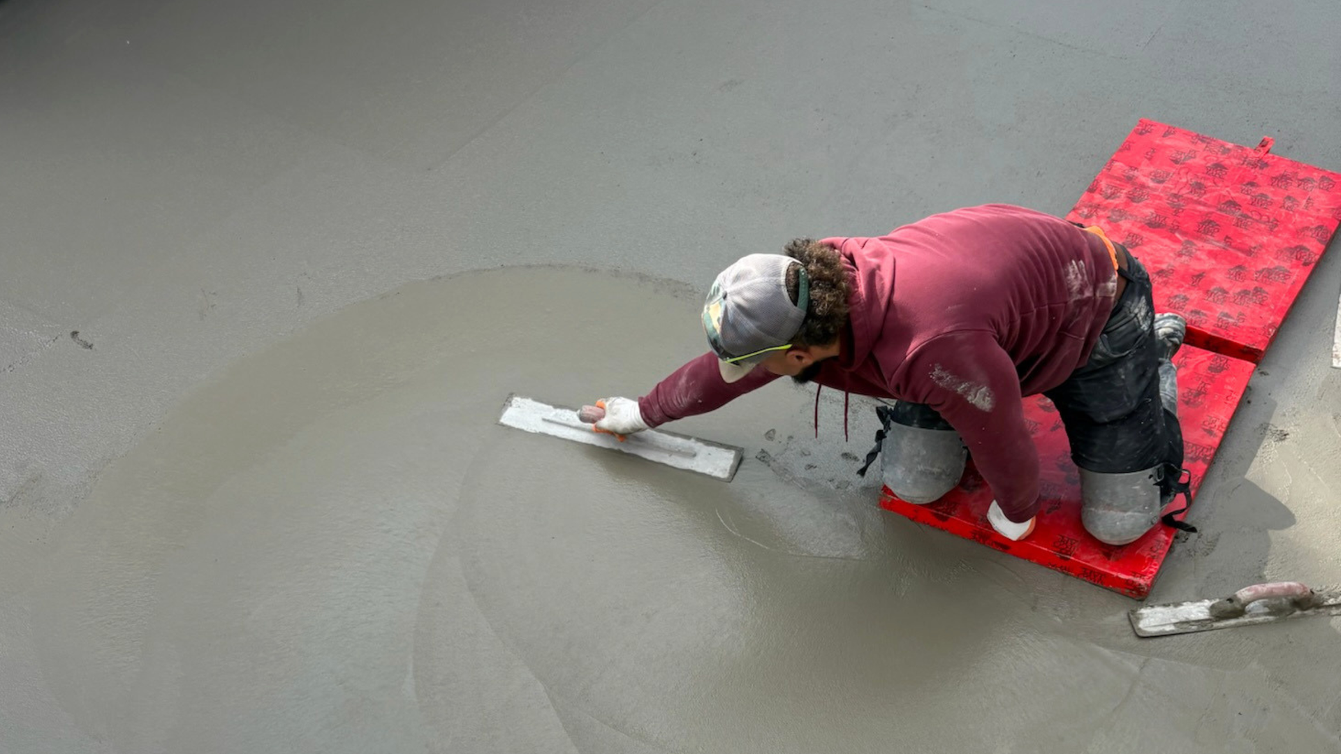 Fresh concrete slab protected by insulated curing blankets during winter in Syracuse Utah