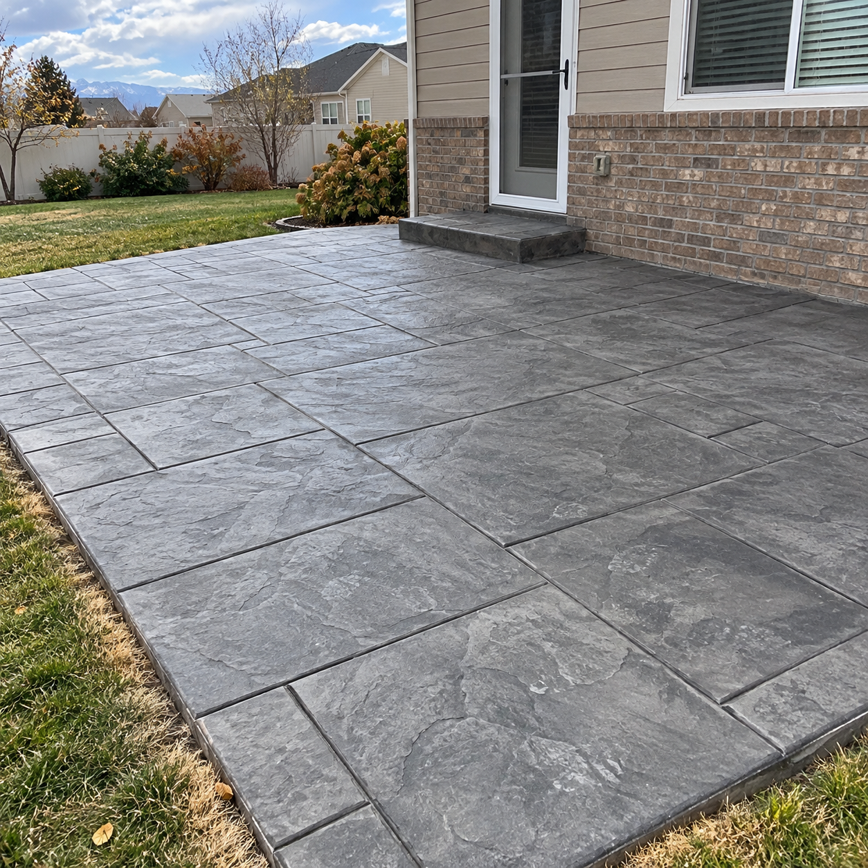 Stamped concrete patio with a slate pattern at a home in Davis County Utah