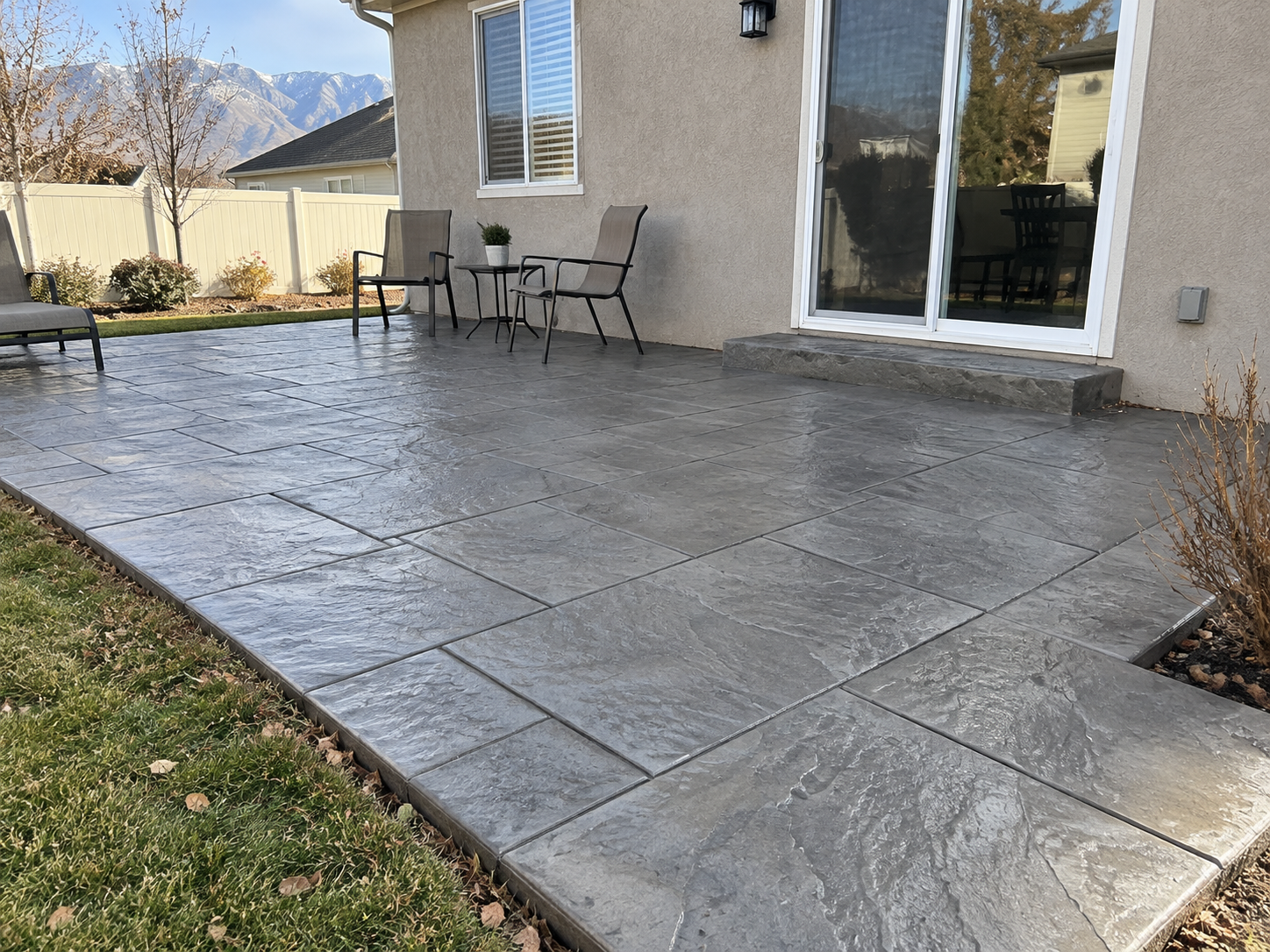Stamped concrete patio with a slate pattern at a home in Davis County Utah