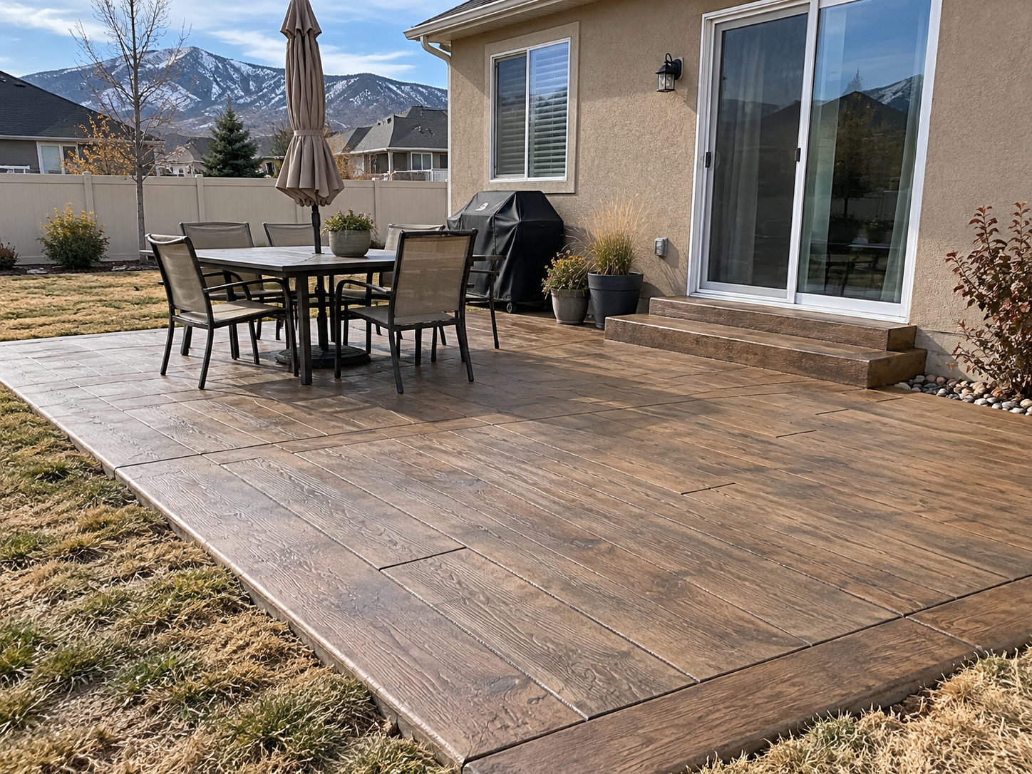 Stamped concrete samples showing slate, flagstone, and wood plank patterns