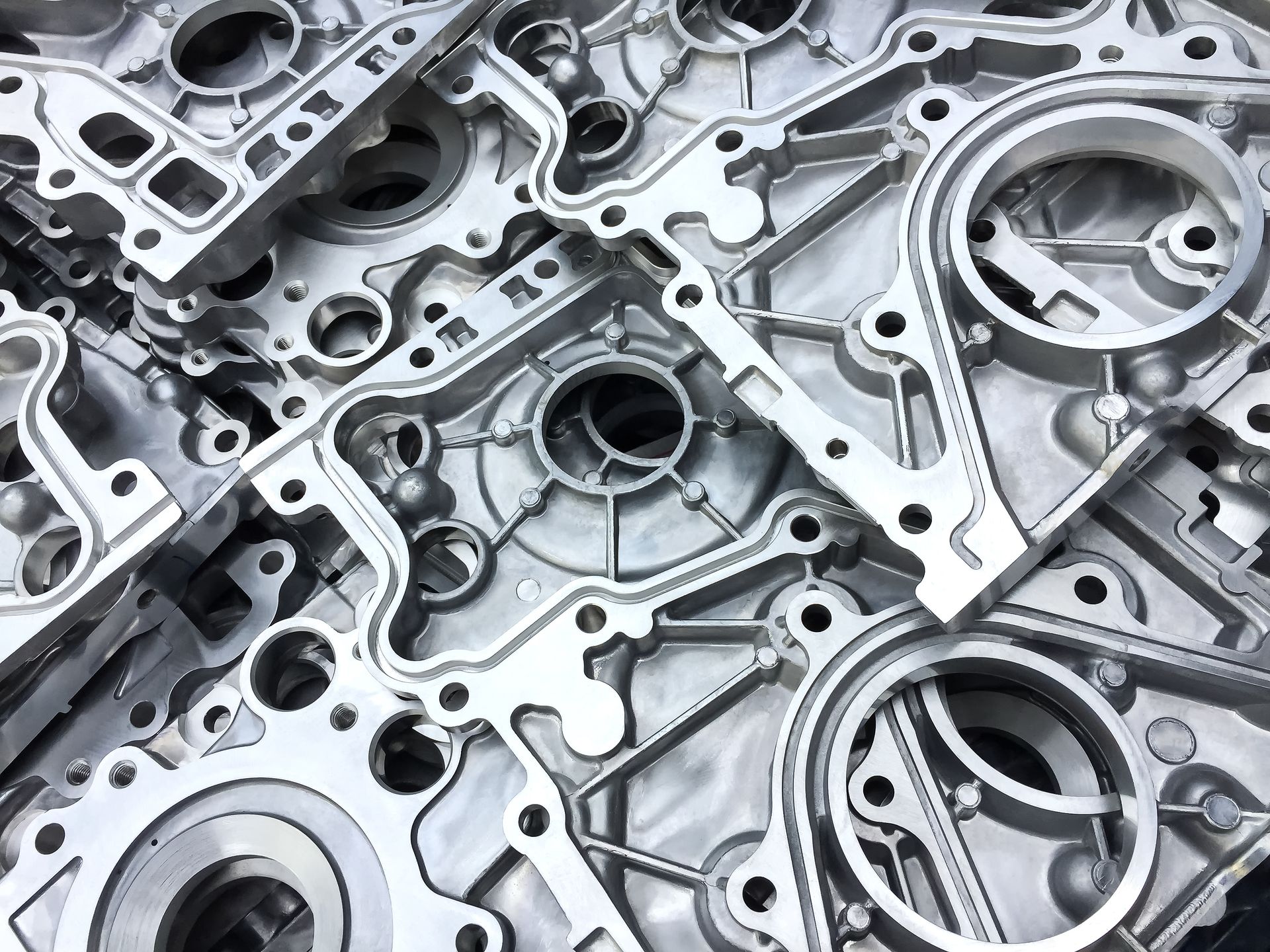 A pile of metal parts sitting on top of each other on a table.